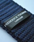 navy blue skinny knitted tie with multicoloured polka dots