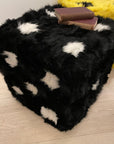 Luxury retro furry dice cube pouffe, handcrafted sustainable Tuscan shearling, black with white spots, stylish statement piece for home by Wildash London at brixbailey.com