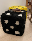 Luxury retro furry dice cube pouffe, sustainable upcycled Tuscan shearling, black with white spots, stylish statement piece for home decor by Wildash London at brixbailey.com