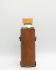 Leather water bottle holder with strap and glass bottle | OUTLET