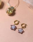 Celestial glass star hoop earrings, luxury gold-plated aubergine huggie hoops, stylish french lock, best-selling cosmic jewelry by Lezzeri at brixbailey.com
