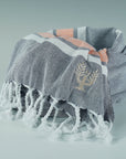 Luxury Hampton hammam towel, premium soft cotton, dark navy with orange and white stripe, handloomed in Turkey, quick-drying, absorbent, stylish yacht beach towel by Wildash London at brixbailey.com