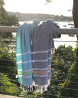 Luxury Hampton hammam towel, premium soft cotton, dark navy with orange and white stripe, handloomed in Turkey, quick-drying, absorbent, stylish yacht towel by Wildash London at brixbailey.com