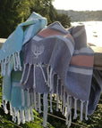 Luxury Hampton hammam towel, premium soft cotton, dark navy with orange and white stripe, handloomed in Turkey, quick-drying, absorbent, yacht-friendly by Wildash London at brixbailey.com