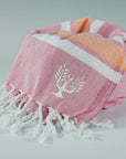 Luxury Hampton Hammam Towel, premium soft cotton, pink and orange stripe, quick-drying, handloomed in Turkey, stylish yacht and beach accessory by Wildash London at brixbailey.com