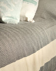 Harrington Bed Throw XL, luxury oversized organic cotton blanket, black with natural zig-zag stripe, handloomed herringbone design, king size by Wildash London at brixbailey.com