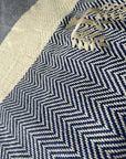 Luxury Harrington Bed Throw XL, premium oversized herringbone blanket in navy blue and natural organic cotton, handloomed, best-selling king size by Wildash London at brixbailey.com