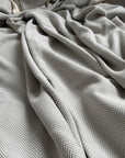 Luxury Harrington Bed Throw XL, oversized 100% organic cotton herringbone blanket, soft grey, handloomed, premium king size, OEKO-TEX certified by Wildash London at brixbailey.com