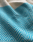 Luxury Harrington Bed Throw XL, premium oversized handloomed organic cotton blanket, teal and natural herringbone design, best-selling king size by Wildash London at brixbailey.com