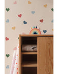 elegant close-up of artisan-made multicolor hearts wallpaper for a refined kids room decor