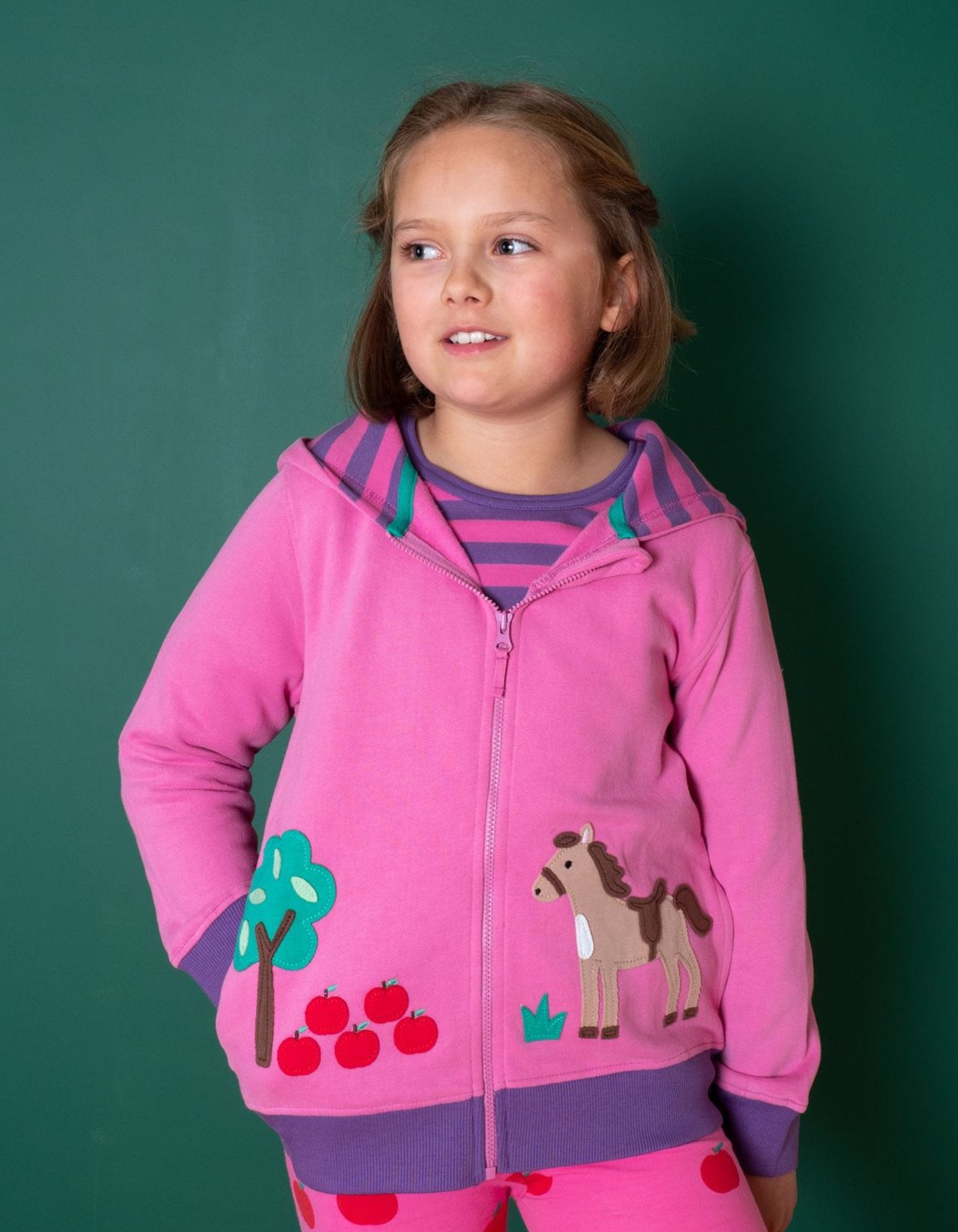 Premium kids hoodie with embroidered horse and apple design, soft organic cotton striped lining, bright pink and purple, GOTS certified by Toby Tiger at brixbailey.com
