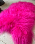 Luxury hot pink sheepskin rug, large Icelandic sheepskin throw, premium handcrafted natural fur, stylish vibrant statement piece by Wildash London at brixbailey.com