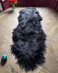 Luxury Icelandic sheepskin rug, premium long fur natural black runner, double back to back, handmade, soft and cozy, best-selling home decor by Wildash London at brixbailey.com
