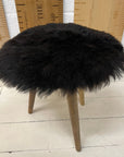 Luxury Icelandic black shorn sheepskin round seat pad, 35cm diameter, premium Scandinavian style, sustainable eco-tanned, soft and breathable by Wildash London at brixbailey.com