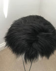 Luxury Icelandic sheepskin seat cover, natural black and white long fur, premium handcrafted roundie, 35cm diameter, sustainable and hypoallergenic by Wildash London at brixbailey.com