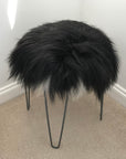 Luxury Icelandic sheepskin round seat cover, natural black and white, 35cm diameter, premium handcrafted fur, hypoallergenic and sustainable by Wildash London at brixbailey.com