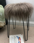 Luxury Icelandic sheepskin roundie seat cover in taupe, premium natural long fur, handcrafted for warmth and comfort, stylish home decor by Wildash London at brixbailey.com