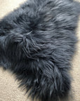Luxury Icelandic sheepskin rug, premium long fur graphite grey, stylish sustainable home decor, handcrafted best-selling authentic sheepskin by Wildash London at brixbailey.com