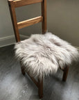 Premium British sheepskin seat cover in dove grey, 100% natural free-range sheepskin, luxury hypoallergenic fur, handcrafted sustainable home decor by Wildash London at brixbailey.com