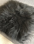Luxury natural black Icelandic sheepskin seat cover, premium undyed fur, handcrafted square pad, 37cm, hypoallergenic, machine washable by Wildash London at brixbailey.com