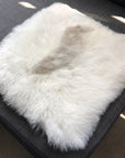 Premium Icelandic sheepskin square seat cover, 37cm, natural white with grey highlights, luxury handcrafted sheepskin, best-selling sustainable home decor by Wildash London at brixbailey.com