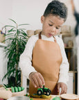 Premium Vegan Leather Apron for Crafts, Baking, and Sensory Play with Adjustable Strap and Front Pocket by Vincabel's Playground at brixbailey.com
