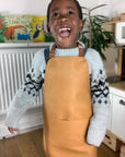 Premium Vegan Leather Apron for Crafts, Baking, and Sensory Play with Adjustable Strap and Front Pocket by Vincabel's Playground at brixbailey.com