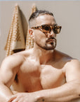 You can't go wrong with this classic genderless shape with a tortoiseshell frame and light tan lens - Category 2 lens - 100% UV protection - Italian M49 Mazzucchelli bioacetate biodegradable frames - Includes recycled PET lens cleaning pouch and bamboo hard case by Reecy at brixbailey.com