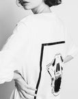 Premium oversized white long sleeve tee with handprinted WWOOLLFF CO. graphics, 100% organic cotton by WWOOLLFF CO. at brixbailey.com