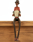 Handcrafted brown resin jazz band squeeze box figurine with lifelike details, perfect for vintage decor by sostter at brixbailey.com