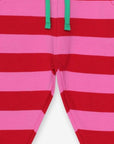 Premium striped baby joggers in pink and red, organic cotton, stylish and comfortable for playtime by Toby Tiger at brixbailey.com