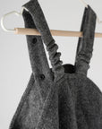 Premium merino wool overalls for kids, stylish gray anthracite, windproof and weather-resistant, adjustable straps, easy diaper change, breathable and temperature-regulating by Mata Origin at brixbailey.com