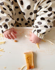 Long Sleeved Baby Bib - Spotty print