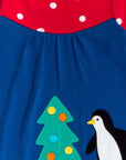 Premium dark blue Christmas dress with penguin applique, long sleeves, red-white polka dot yoke, GOTS certified organic cotton by Toby Tiger at brixbailey.com