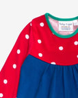 Premium dark blue Christmas dress with penguin applique, long sleeves, red-white polka dot yoke, GOTS certified organic cotton by Toby Tiger at brixbailey.com