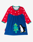 Premium dark blue Christmas dress with penguin applique, long sleeves, red white polka dot yoke, GOTS certified organic cotton by Toby Tiger at brixbailey.com
