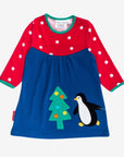 Premium dark blue Christmas dress with penguin applique, long sleeves, red-white polka dot yoke, GOTS certified organic cotton by Toby Tiger at brixbailey.com