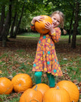 Premium organic cotton kids pumpkin skater dress, long sleeve Halloween outfit, soft GOTS-certified eco-friendly fabric, stylish autumn wardrobe essential by Toby Tiger at brixbailey.com