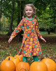 Premium organic cotton kids pumpkin skater dress, long sleeve Halloween outfit, soft GOTS certified eco-friendly fabric, trending fall style by Toby Tiger at brixbailey.com
