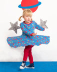 Luxury astronaut print skater dress with long sleeves, soft organic cotton, sustainable fabric, stylish swing skirt, snap buttons by Toby Tiger at brixbailey.com