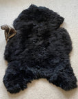 Luxury natural black Icelandic sheepskin rug, premium undyed shorn 50mm sheep hide, authentic free-range hypoallergenic fur, best-selling sustainable decor by Wildash London at brixbailey.com