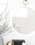 Round loop brass mirror, elegant oversized brass frame, stylish statement piece for home decor, luxury round wall mirror by Ella James at brixbailey.com