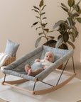 Premium Growing Green Baby Bouncer, handcrafted organic cotton cover, beechwood frame, peacock feather print, gender-neutral blue-green by Ella James at brixbailey.com