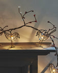 Luxury battery-operated LED robin lights garland with 12 dainty birds, warm white bulbs, and faux winter berries by Ella James at brixbailey.com