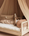 Luxury Nobodinoz solid oakwood junior bed, premium low-level design, stylish 50s rounded legs, best-selling timeless piece for kids by Ella James at brixbailey.com