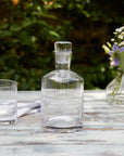 A Crystal Decanter with Ovals Design