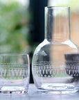 A Crystal Carafe Set with Ovals Design