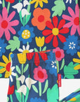 Premium organic cotton kids pajamas with floral snowdrop daisy tulip print on dark blue by Toby Tiger at brixbailey.com
