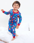 Premium organic cotton kids pajama set, cozy two-piece with camping bear print, soft GOTS-certified fabric, machine washable by Toby Tiger at brixbailey.com
