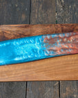 Walnut striking blue and bronze river board